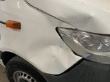 a white van that is parked in a garage