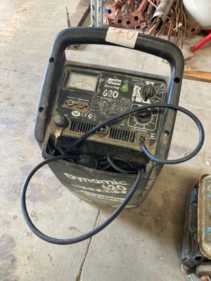 an image of a welding machine sitting on top of a cement floor