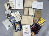 a lot of books that are laying on a table
