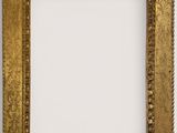 a gold picture frame with a decorative pattern on it