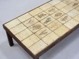 a coffee table with a tile design on it