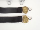 two black belts with gold buckles on a white background