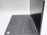 a laptop computer sitting on top of a white table