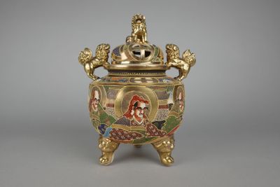 an image of a gold and enamel vase with a woman on it