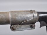 a close up of a gun with a metal handle
