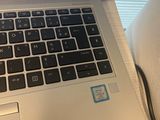 a laptop computer that is sitting on a desk