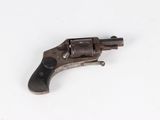 an old gun on a white surface with a white background