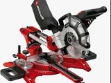 a close up of a red and black circular saw on a white background
