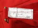 a close up of a red jacket with a label on it