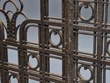 an image of a metal screen with a decorative design on it