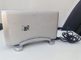 a silver toaster sitting on a table with a cord attached to it