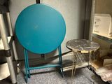a blue table and a chair in a room