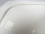 a close up of a white toilet bowl with the lid down