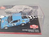 a box with a toy car inside of it on a table
