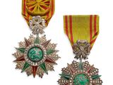 deux médailles avec des rubans et une étoile sur fond blanc