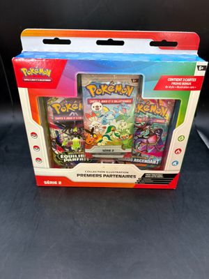 the box contains a variety of pokemon cards and a card holder