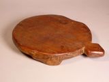 a wooden paddle that is sitting on a table