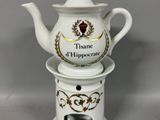 a tea pot with a tea pot on top of it