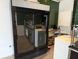an image of a kitchen with a refrigerator and a sink