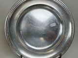 a silver plate that is sitting on a table