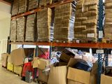 a large amount of boxes on the shelves in the warehouse