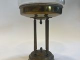 a small table with a glass bowl on top of it