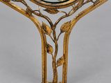 brass coffee table with a glass top and a metal frame