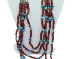 a close up of a necklace on a mannequin mannequin