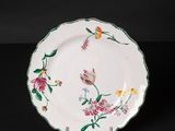 an image of a plate with flowers and butterflies painted on it