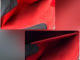 a close up of the inside of a red purse with a zipper
