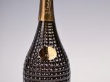 a black and gold bottle of champagne with a gold label
