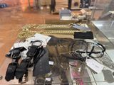 a glass display case with a lot of jewelry on it