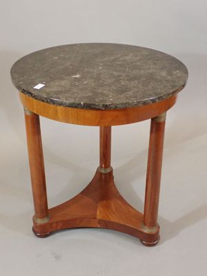 Guéridon circulaire en acajou reposant sur trois pieds en co… - Photo 1