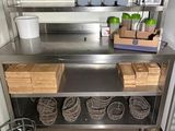 a stainless steel counter with baskets on it in a kitchen