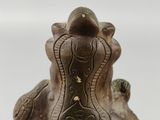 a statue of an elephant that is sitting on a table