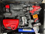 a tool kit in a black case on the floor
