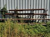 a bench that is sitting in the grass near a building