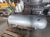 a large metal tank sitting on a pallet in a warehouse