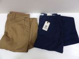 pair of men ' s chino shorts in tan and navy