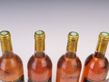 three bottles of wine sitting next to each other on a table