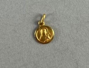 a gold coin with a picture of a woman on it