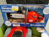 a box with a chainsaw and a remote control in it