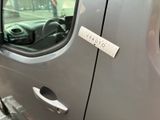 a sticker on the door handle of a car