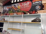 a display of lawn mowers and lawn equipment in a store