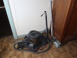 a vacuum that is sitting on the floor next to a door