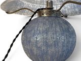 an image of a lamp with a blue shade on it