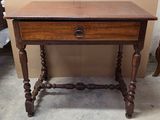 a small wooden table with a drawer on top of it