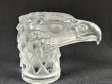 an image of a glass figurine of a bird on a black background