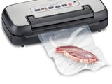 a close up of a vacuumr with a piece of meat in it