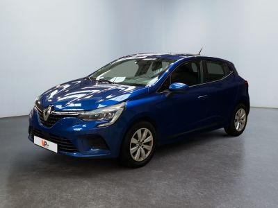 a blue car is parked in a room with a white wall